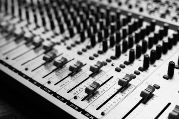 Sound mixer audio mixing console with faders and buttons. Sound recording studio