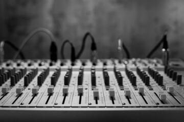 Closeup of sound mixer audio mixing console. Music concept in sound recording studio