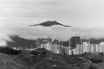 Mountain Tai Mo Shan and skyline of Yuen Long district in Hong Kong city