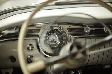 Vintage Classic Car Dashboard with Retro Speedometer and Steering Wheel