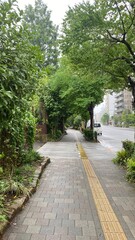 Rainy path at the sidewalk of the street of Ueno Tokyo Japan, downtown city walk, year 2022 June 6th, rainy day

