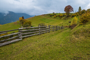 Cloudy and foggy day autumn mountains scene. Peaceful picturesque traveling, seasonal, nature and countryside beauty concept scene. Carpathian Mountains, Ukraine.