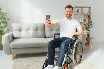 disabled man in a wheelchair taking a selfie.