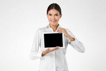 Image of young woman, company worker, smiling , standing over background