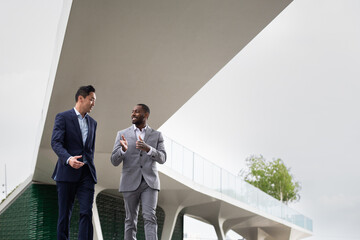 White collar workers meeting outdoors in a city