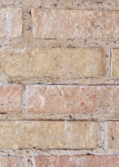Vintage wall made of light beige bricks. Photo for backdrops and backgrounds