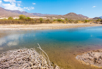 River among the mountains. Calm transparent ovda. Summer landscape. Boom Gorge, Kyrgyzstan.