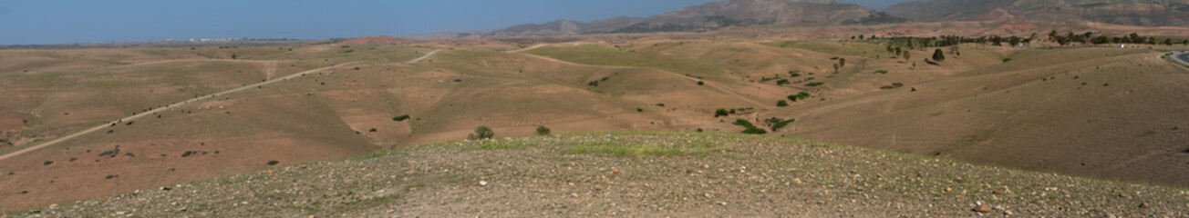Obraz premium Camal riding in Marrakesh mountain range in Morocco Africa during spring
