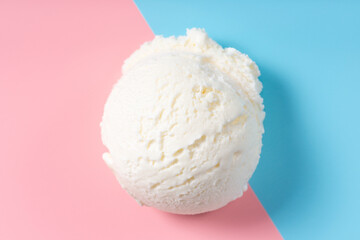 vanilla scoop of sundae ice cream on blue and pink background, top view