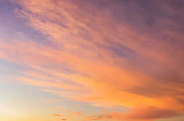 Sunset sky with orange sunrise on blue sky background in the morning.