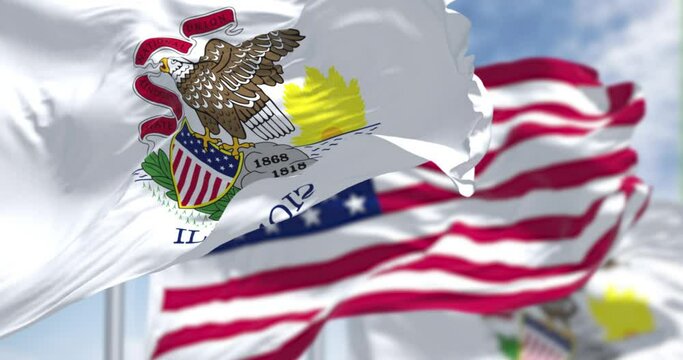 Seamless loop in slow motion with two Illinois state flags waving along with the national flag of the United States of America.