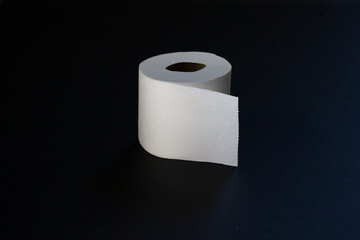 Toilet paper photographed on black background