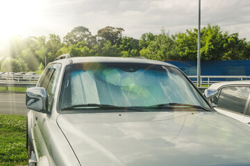 Protective screen on the windshield reflects heat and the sun's rays heating the interior of the...