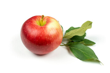A large ripe red apple with leaves on a white isolated (isolate) background.