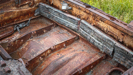 The war in Ukraine, the engine cover from the tank, damaged radiators in the roof of the tank engine