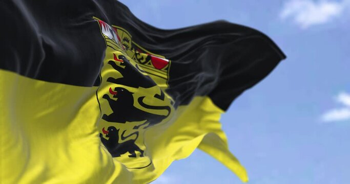 Seamless loop in slow motion with the flag of Baden Württemberg waving in the wind on a clear day