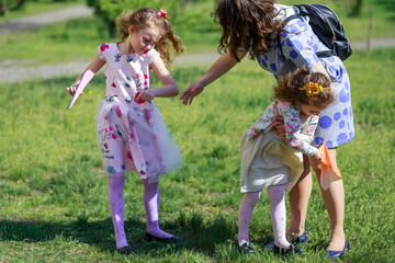 Mom tries to hug her second daughter for a walk. Problems with teenagers