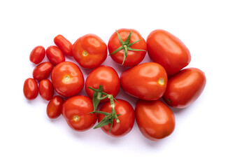 A group of assorted tomatoes isolated over white background