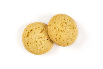 Two round oatmeal cookies for a baby close-up on a white isolated background.