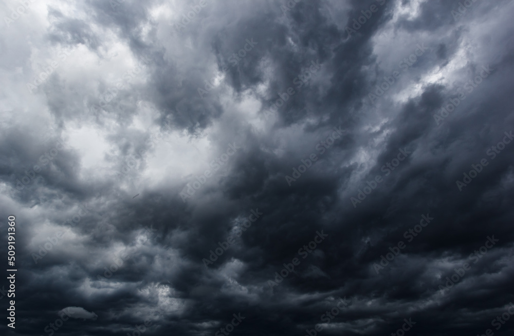 Poster the dark sky with heavy clouds converging and a violent storm before the rain.bad or moody weather s