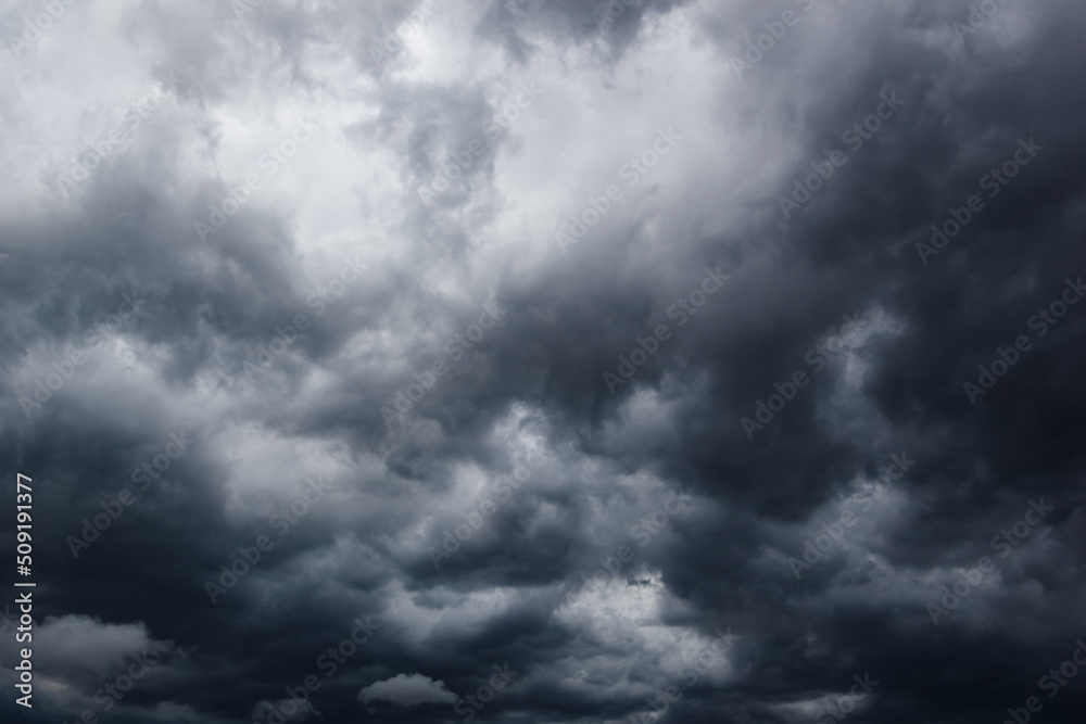 Poster the dark sky with heavy clouds converging and a violent storm before the rain.bad or moody weather s