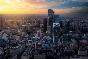 Elevated sunset view of the financial skyscrapers at the City of London, England