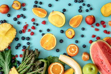 Fruits, berries and vegetables on a blue background.