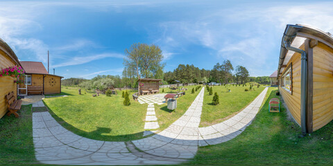 Full seamless 360 degree HDRI spherical panorama. House with a large green lawn, a bathhouse and a patio, an eco-farm for guests, sunny weather with blue sky	