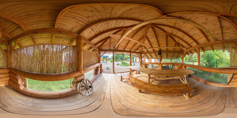 Obraz na płótnie Canvas Full seamless 360 degree HDRI spherical panorama In the gazebo with a large barbecue grill, a large log gazebo. Log patio with tables and chairs. VR content