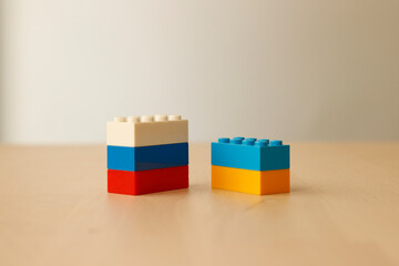 Tell the ukraine russia war with toy blocks. Abstract expressions. Symbols of children's psychology
