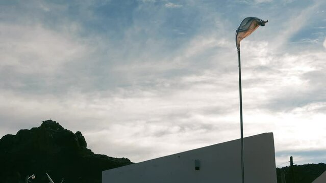 Argentine Flag Against Sunset Sky at a Mountain School in the Andes.  
