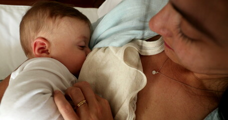 Mother breastfeeding baby infant, casual moment of mom breastfeed baby