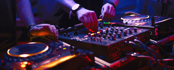 Dj musician playing techno music on the stage