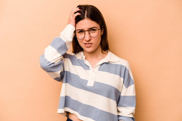 Young hispanic woman isolated on beige background tired and very sleepy keeping hand on head.