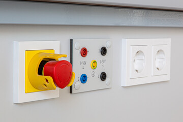 electrical installation for lab classes in school or university, plugs and emergency power off.