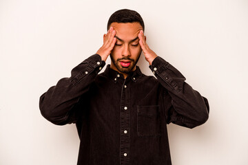 Young hispanic man isolated on white background touching temples and having headache.