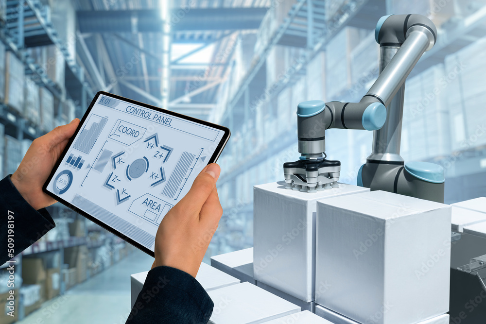 Poster warehouse manager with digital tablet controls robot arm