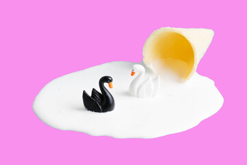 Black and white swans swimming in melted ice cream