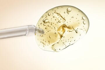 Vitamin C serum liquid texture with dropper on the desk