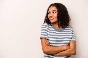 Young African American woman isolated on white background smiling confident with crossed arms.