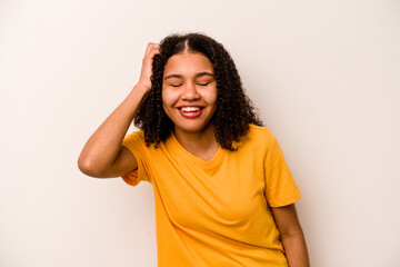 Young African American woman isolated on white background joyful laughing a lot. Happiness concept.