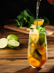 Refreshing ice tea with lemon, lime and peppermint. Copy space.