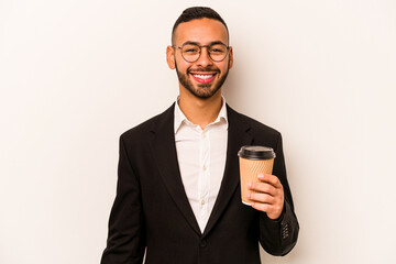 Young business hispanic man holding takeaway coffee isolated on white background happy, smiling and cheerful.