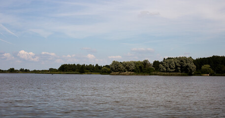 Lake shore, water surface of calm wate