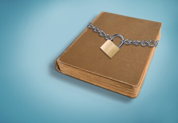 The book is locked under lock. Secret archive. Chain on the book of secrets is under lock and key.