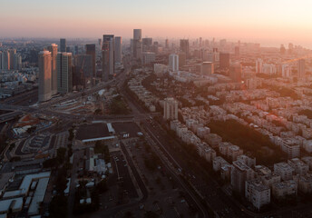 Naklejka na ściany i meble Tel Aviv sunset view from above. Aerial panorama. Tall modern buildings