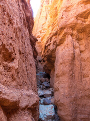 Red rocks and a passage between rocks. Clay canyons. Issyk-Kul region in Kyrgyzstan. Travel and tourism