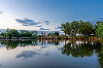 Fototapeta na wymiar Scenic landscape at Bokod lake in Hungary, dramatic sky