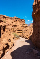 Red tales from clay. Issyk-Kul region in Kyrgyzstan. Beautiful mountain landscape. Tourism and...