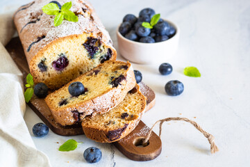 Blueberry cake on white background. Homemade sweet baking. Free space for text.